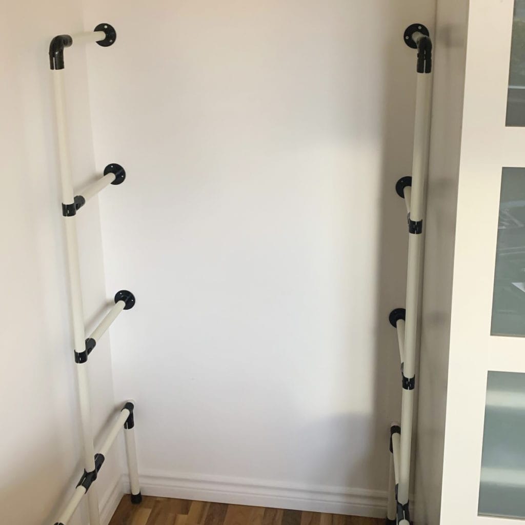 DIY shelving system with pipes and fittings