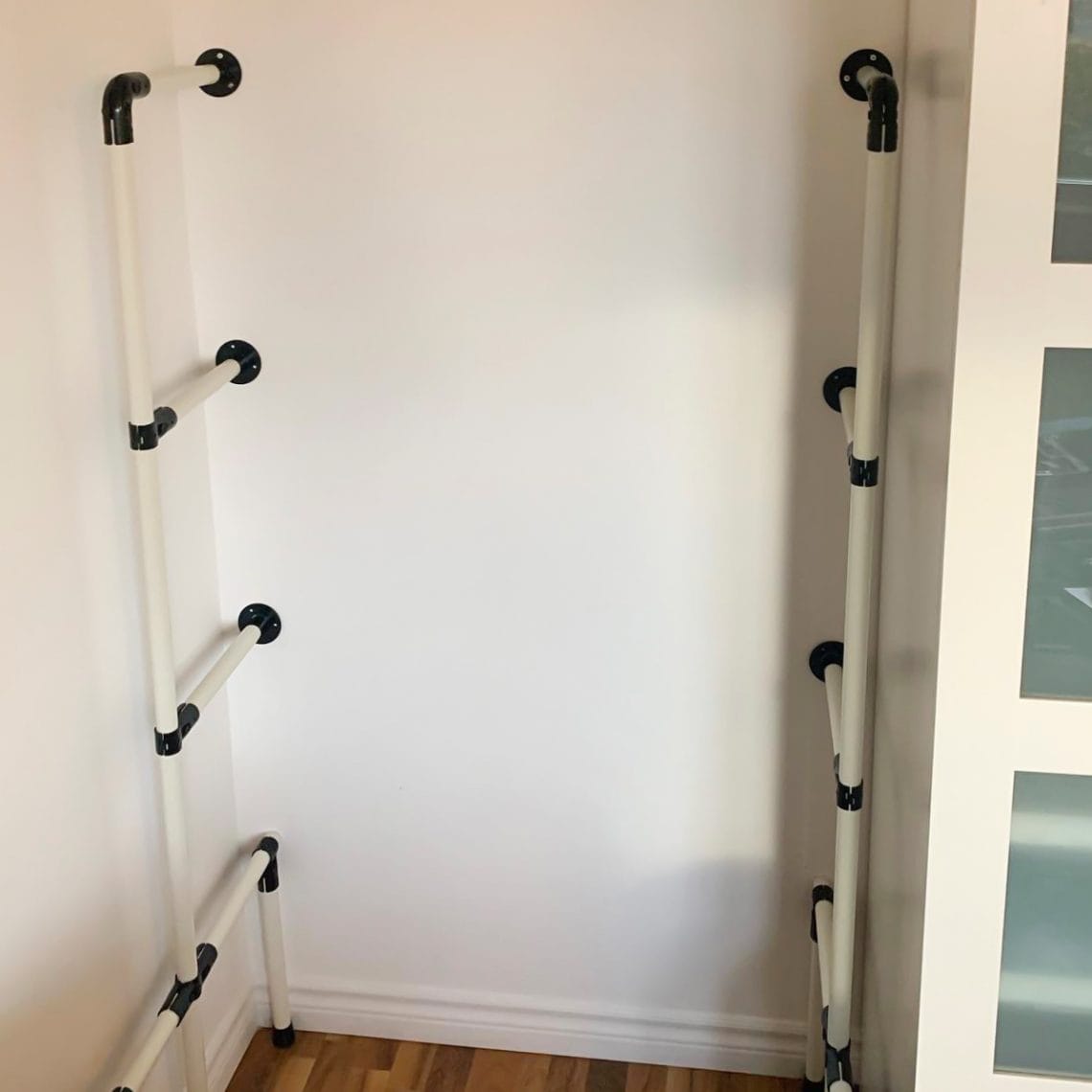 DIY shelving system with pipes and fittings